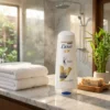 Woman using Dove Intense Repair Conditioner 170ml for smooth healthy hair