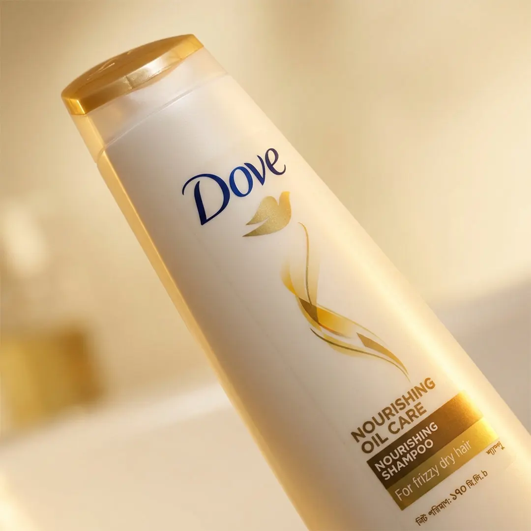 Dove Nourishing Oil Care Shampoo 170ml angled bottle view on soft background